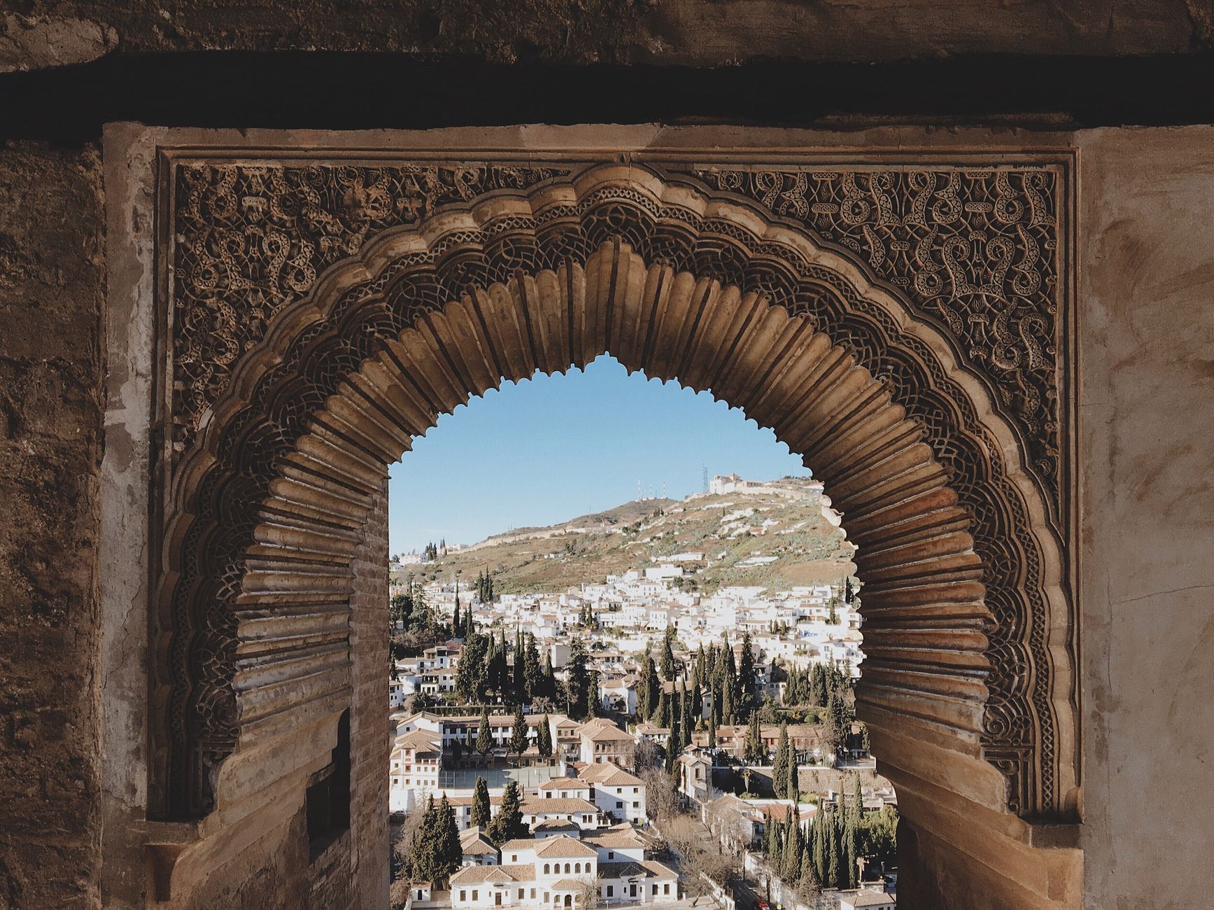 town behind ornamented wall of alhambra
